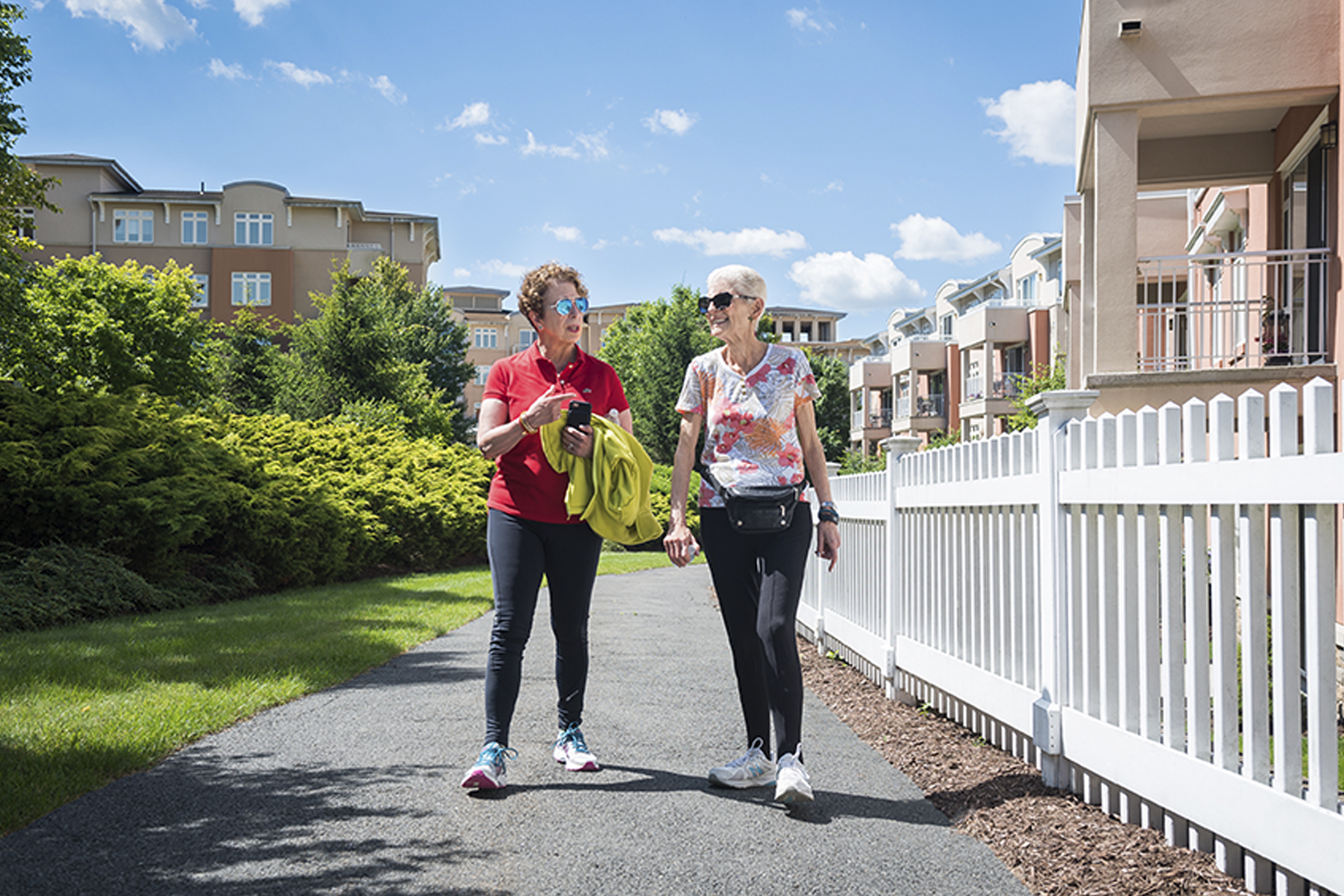 two older adult women walking